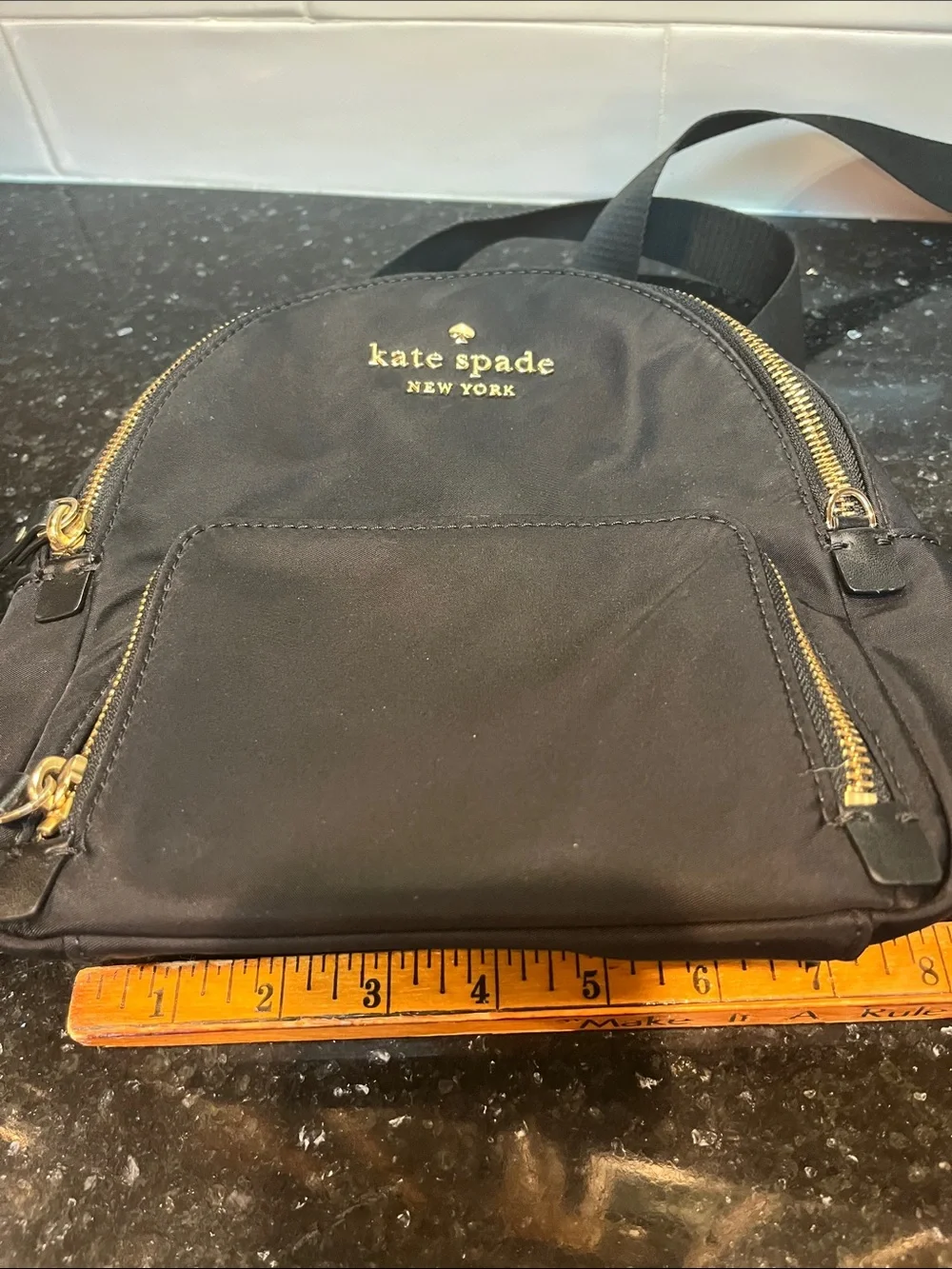 Kate Spade New York Black Mini Backpack with Gold Hardware